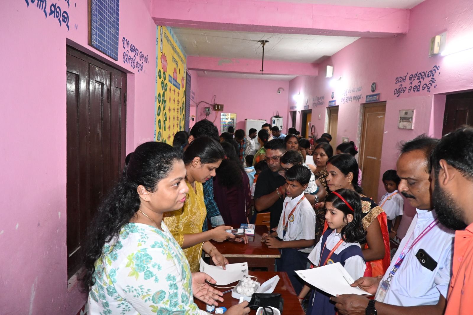 People queue for their check-ups